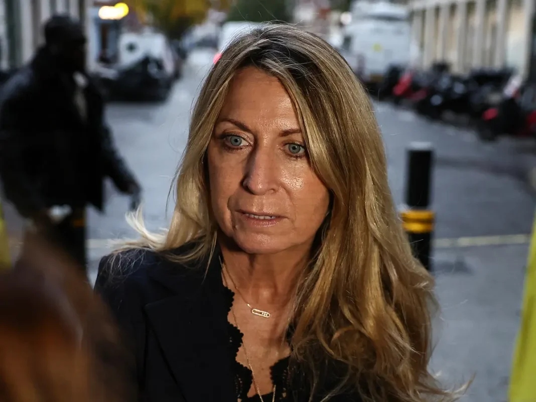 Deborah Turness, who resigned the day before as BBC News CEO, faces the media as she arrives at the offices of the BBC in London.