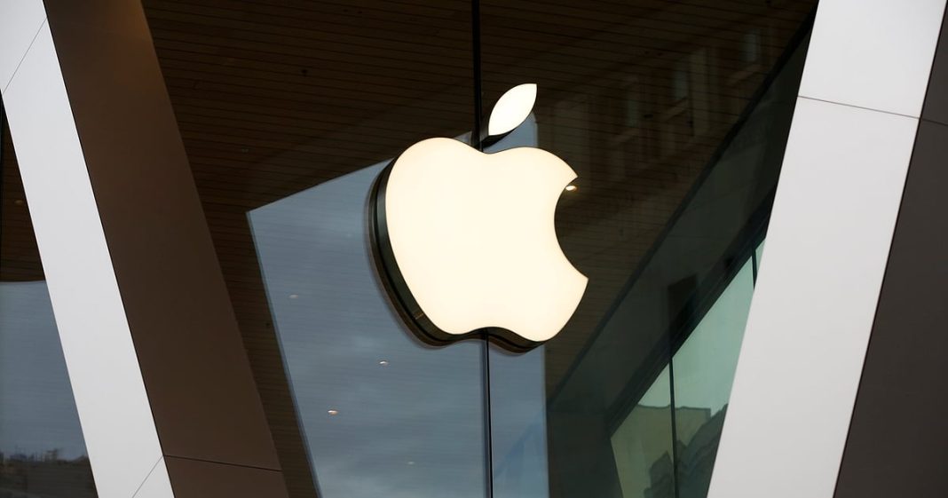 The Apple logo adorns the facade of a store.