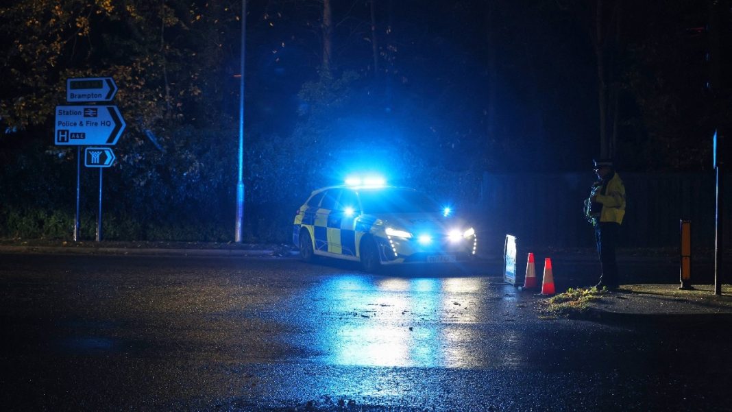 Police work at the Huntingdon, train station in Cambridgeshire, after people were stabbed on a train (Image: AP)