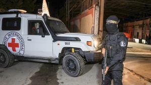 Red Cross vehicles arrive to receive from Hamas the bodies of deceased hostages who had been held in Gaza since the deadly Oct. 7, 2023 attack, as part of a ceasefire and a hostages-for-prisoners swap deal, in Gaza City on Oct. 14, 2025. (Dawoud Abu Alkas/Reuters)