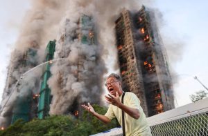 The residential towers had been under renovation since July 2024, wrapped in bamboo scaffolding and green construction mesh. (Reuters Image)