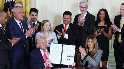 US President Donald Trump and First Lady Melania Trump with other officials at the White House. (Getty Images via AFP)