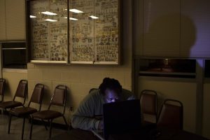 A student with Myopia stares into his laptop screen in a porrly lit room. (Photo: Reuters)