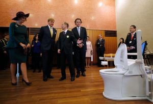 Netherlands' royalty visit toilet manufacturer TOTO's booth, where bedside flush toilets are on disaply. (Photo: Reuters)