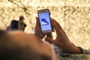 A person checks a social media reel while resting. (Photo: Reuters)
