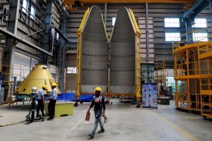 Employees works next to Heat Shield of PSLV in Coimbatore, India. (Photo: Reuters)