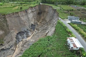 A drone view shows a large expanding sinkhole in the farmland in Aceh province, Indonesia. (Photo: Reuters)