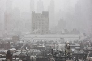 Snow covers residential buildings during a winter storm in New York City. (Photo: Reuters)