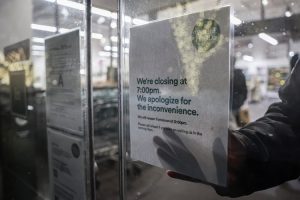 A closing sign is pasted on a door as snow falls during a winter storm in New York City, US. (Photo: Reuters)