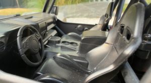 On the inside, the truck gets a scale-style cabin, although it isn’t as finely detailed as the exterior.