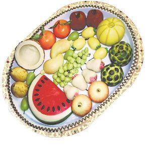 Tatwa mishti platters are not just markers of status but also a creative canvas for sweetmakers. (Above) A platter resembling a fruit salad. (Courtesy Jalbhara Surjya Kumar Modak)