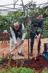 PM Narendra Modi with Israeli President Isaac Herzog plants a tree in the Presidential Gardens under the ‘Ek Ped Maa Ke Naam’ initiative, in Jerusalem
