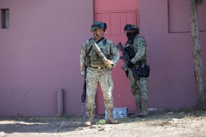 Members of the Mexican Army conduct a security checkpoint on the Morelia Patzcuaro Highway to prevent vehicle fires and road blockades in Michoacan state, Mexico, on February 23, 2026. Mexico has deployed 10,000 troops to quell clashes sparked by the killing of the country's most wanted drug lord, which have left dozens dead, officials said