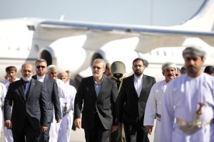 This photo released by Iran's Supreme National Security Council office shows Secretary of the Supreme National Security Council Ali Larijani (C) arriving in Muscat, Oman on February 10, 2026. (Photo by HANDOUT / Iran's Supreme National Security / AFP)