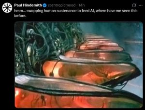 A user replies with the screenshot of the film, The Matrix, where AI used humans for their energy needs.