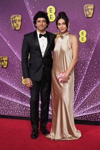 Farhan complemented her in a classic black tuxedo with satin lapels and a bow tie. (Photo: Getty Images)