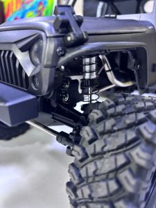 The articulation is remarkable, with the suspension flexing and adjusting to the terrain, while the strong servo ensures sharp and accurate steering.