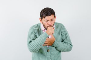 Frequent coughing is one of the symptoms along with hoarse voice in case of any underlying condition affecting the vocal cords. (Freepik)