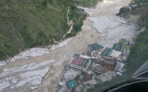 Flood waters flow next to a residential complex after heavy rains in Uttarakhand. (Photo: Reuters)