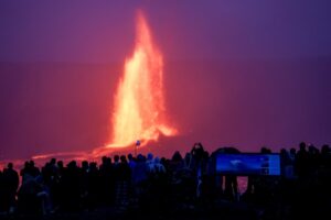 People watch as lava erupts from the Kilauea volcano in Hawaii. (Photo: Reuters)