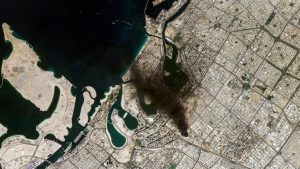 Industrial area in Dubai covered in smoke, seen in a satellite image. (Credit - Planet Labs PBC/Reuters)