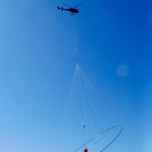 A helicopter carrying the equipment used to scan the lake for the study. (Photo: University of Utah)