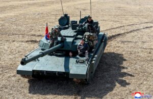 North Korean leader Kim Jong Un and his daughter Kim Ju Ae ride a tank during what North Korean state news agency KCNA reports is an offensive tactical drill involving a new type of tank, at a training base in Pyongyang, North Korea, March 19, 2026, in this picture released by North Korea's official Korean Central News Agency.