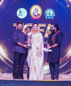 Rashmika Mandanna received the Gaddar Award from Telangana CM Revanth Reddy and Ram Charan.
