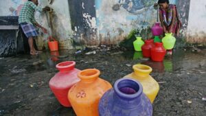 Residents fill their empty containers with water from a municipal tap in Chennai. In June 2019, Chennai's four main reservoirs ran completely dry. Water tankers that arrived to help sometimes carried water that was black and smelled of sewage. (Photo: Reuters)