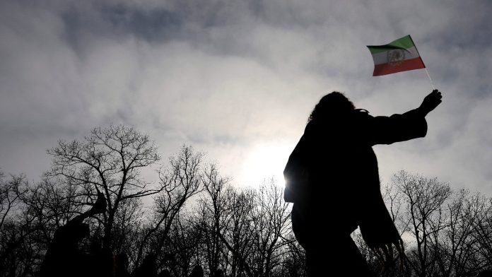 Iranians celebrate the death of their country's Supreme Leader Ayatollah Ali Khamenei in a park in central Bucharest, Romania. (Credits: Reuters)