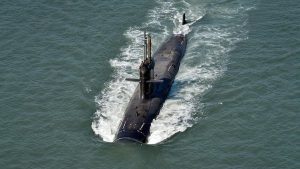 An aerial view of a Kalvari-class Indian Navy submarine cutting through open waters during a patrol. (Photo: PTI)