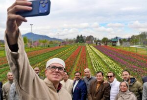 Jammu and Kashmir Chief Minister Omar Abdullah poses for a selfie during a visit to the Tulip Garden, in Srinagar. (Photo: PTI)