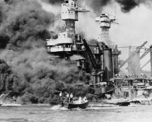The battleship USS West Virginia on fire after being hit by multiple Japanese bombs and air-dropped torpedoes. (Image: US Navy Office of Public Relations)