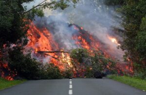 Molten lava from the volcano blocks the main national RN 2 road. (Photo: Reuters)