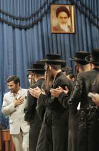 Iran's former President Mahmoud Ahmadinejad (L) welcomes participants of a Holocaust conference in Tehran, in 2006. (Image: Reuters)