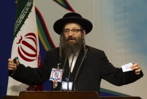 Rabbi Yisroel Dovid Weiss, of the organisation Jews United Against Zionism, speaks during a meeting with guests of the International Conference on Global Alliance Against Terrorism, in Tehran, in 2011. (Image: Reuters)