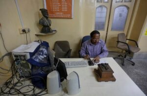 An employee with a Morse code machine at the Central Telegraph Office in Mumbai. (Photo: Reuters)