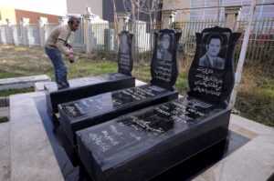 A man washes gravestones of Jews who were killed in Iran-Iraq war (1980-88) at the Beheshtieh Jewish Cemetery in Tehran. The cemetery of the Jewish community in Tehran was established in 1937. Thousands of Jews have been buried there, including those killed in the war. (Image: Reuters)
