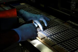 A technician checks the machine at a solar panel manufacturing hub in Greater Noida. (Photo: Reuters)