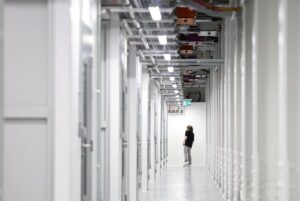 An IT technician walks inside a data centre. (Photo: Reuters)