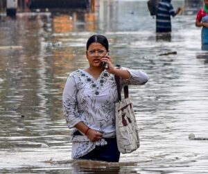 A woman wades through a water-logged street in Guwahati, Assam. (Photo: ITG)