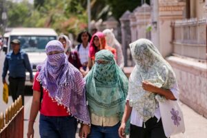 Women cover themselves on a hot day during the summer season in Uttar Pradesh. (Photo: PTI)