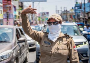 A police personnel manages traffic on a hot summer day, in Nainital, Uttarakhand. (Photo: PTI)