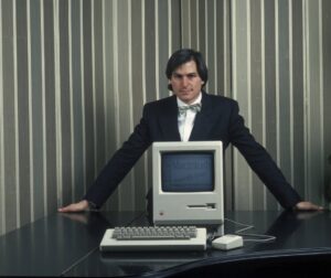 Steve Jobs with a Macintosh computer in 1984, the year it was launched.