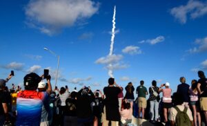 People observe the launch of Artemis II from the A Max Brewer Bridge in Titusville, Florida, on 1 April 2026 in Cape Canaveral, Florida.