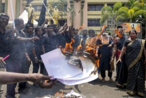 DMK workers burn copies of the proposed Delimitation bill during a protest at the party office in Chennai. (Photo: PTI)
