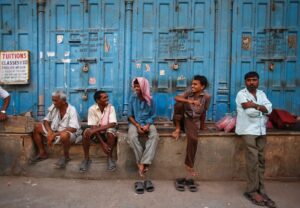 Workers take rest in front of closed shops on a hot summer day in the old quarters of Delhi. (Photo: Reuters)