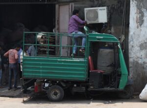 A technician repairs an air-conditioner on a hot summer day in Ahmedabad. (Photo: Reuters)