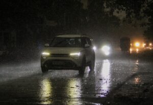 A car passes through on a rainy day, in Rishikesh. (Photo: PTI)